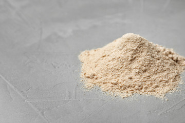 Fototapeta na wymiar Pile of buckwheat flour on table
