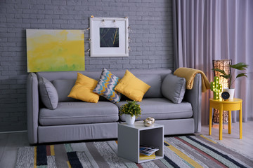 Stylish living room interior with comfortable sofa