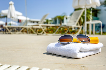 sunglasses and towel. 