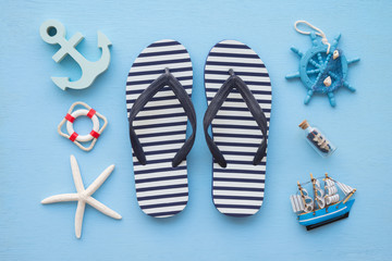 Flat lay of tropical beach summer holiday with beach summer accessories for traveling on blue...