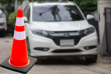 Traffic cone background car blurred
