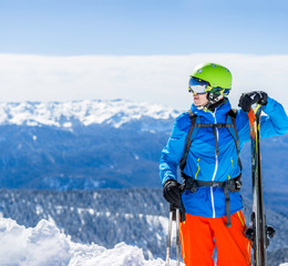 Photo of sporty man with skis