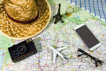 Travel Concepts Planning a trip with a camera. Model aircraft A small glass globe and a hat are placed on the map.