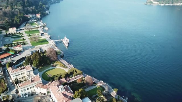 como lake aerial view with villas and gardens
