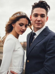 Groom and bride in charles bridge. winter wedding in Prague