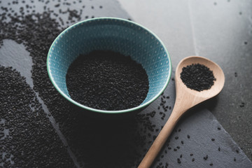 black sesame on wooden spoon