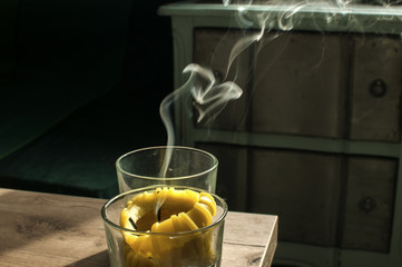 White smoke from recently extinguished candle on home interior background
