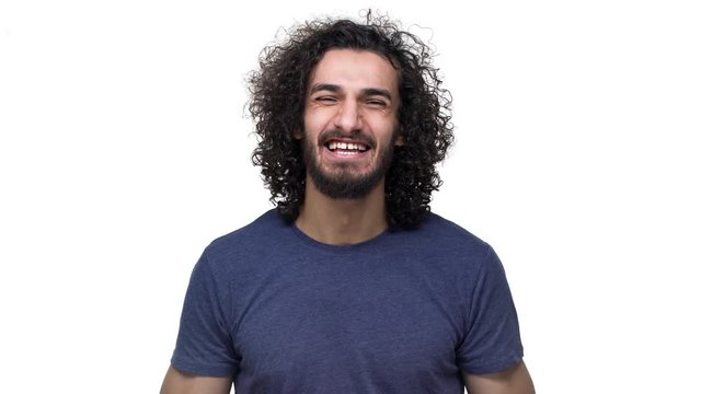 Portrait of brunette brazilian man gesturing emotionally and expressing success or good result, isolated over white background. Concept of emotions
