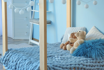 Comfortable bed in modern children room