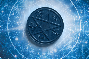 a magic pentagram lying in astrology starry blue background 