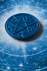 a magic pentagram lying in astrology starry blue background 