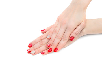 Female's hands with red manicure on white background.