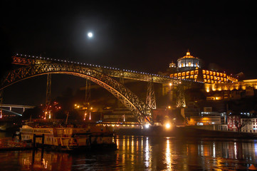 Night view of the Eifel's Dom Luís I Bridge in Porto, Portugal