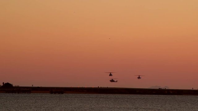 Helicopters returning back to base in the evening