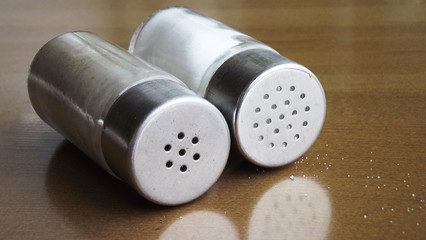 Salt and pepper in the salt shaker on the table.