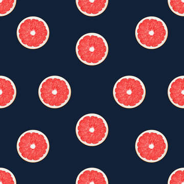 Grapefruit in flat lay Seamless pattern with halves of ripe grapefruits on dark blue background Top view Trendy flat lay photo pattern