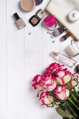 Fototapeta na wymiar Women cosmetics and fashion items on white wooden background