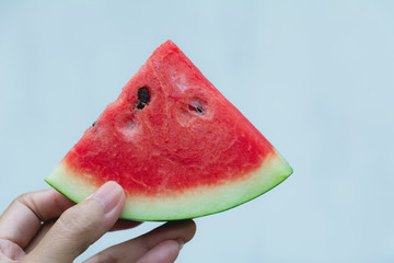 Woman holdind watermelon. Portrait woman is holding slice of watermelon.