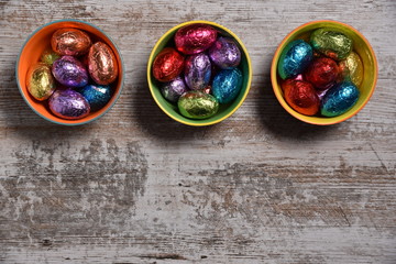 Easter eggs on colorful bowls