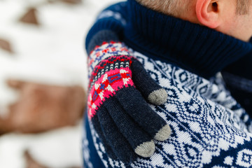 Boyfriend and girlfriend traveling lifestyle, tranquility and contemplation on a cold winter vacation. Winter nature. Young couple in winter warm sweaters and jeans hugging in the Park in winter.