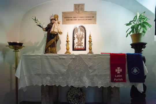 Lisbon, Portugal - October 24, 2016: Crypt interior marking the birthplace of Saint Anthony of Lisbon aka Padua or Padova, beneath the Santo Antonio de Lisboa Church. Altar with statue and reliquary