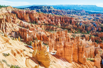 Red-yellow rocks in Bryce Canyon. Panorama of the mountain massif. A tourist place, a stone forest.