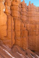 Red-yellow rocks in Bryce Canyon. Panorama of the mountain massif. A tourist place, a stone forest.