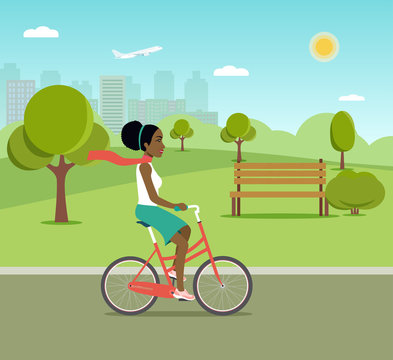 Afro american woman riding a bicycle in park. Vector flat illustration.