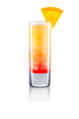 Yellow shot cocktail with slice of lime and ice cubes isolated on white background. Clipping path