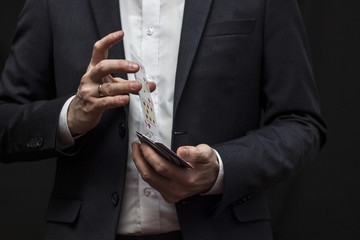 Man with flying playing cards