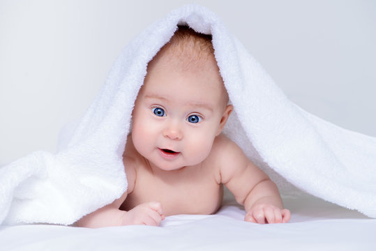 little baby under towel