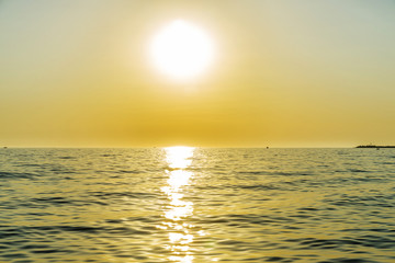 Obraz premium Sunset over the Mediterranean sea in summer in Sicily, Italy