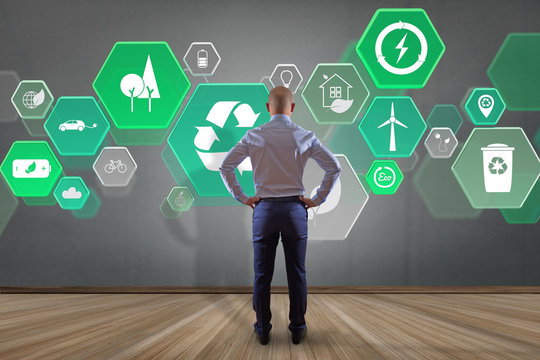 Businessman in front of a wall with Technology ecologic interface