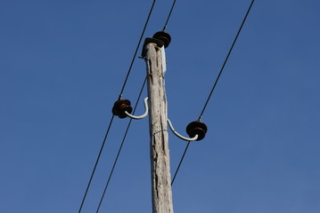 Old electric pole with power lines