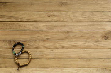 old boards of oak. in the lower left corner is a rosary. suitable for background.
