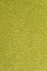 Fototapeta premium bath towel bright green. textured fabric background