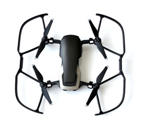 Black quadrocopter with protection of screws on white background