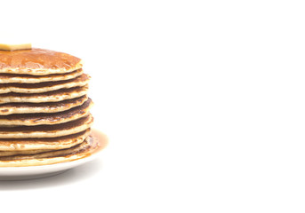 A Stack of Fresh Buttermilk Pancakes with Butter and Syrup on a White Background