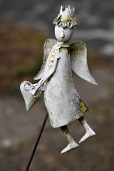 A small figure of an angel as a tomb decoration