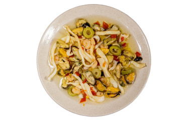 Seafood salad with shrimp, squid and mussels isolated on white background