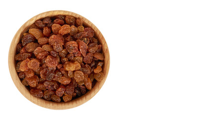 delicious and healthy raisins in hand in wooden bowl isolated on white background, healthy sweet snack. copy space, template