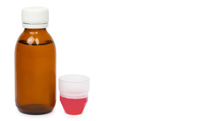 cough syrup, or the medicine with a measuring Cup and medicine. copy space, template