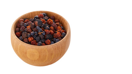healthy dried berries in wooden pot isolated on white background. copy space, template