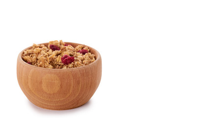 homemade granola with dried fruits in wooden pot isolated on white background. copy space, template
