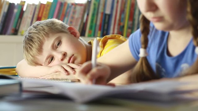 Dissatisfied, offended boy. Sad child in the classroom.