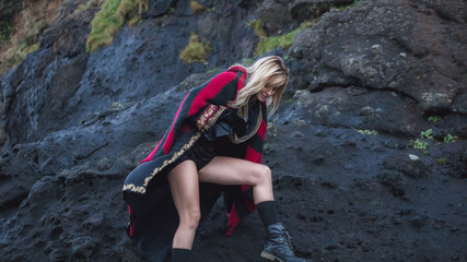 Cute Blonde Woman Climbing on Rocks