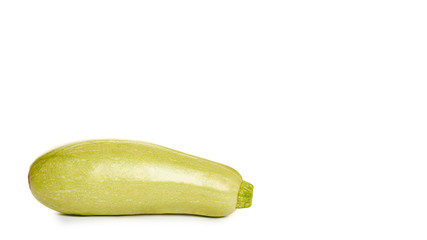 green fresh organic zucchini in hand isolated on white background. copy space, template.