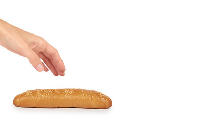 Light and delicious baguette bread in hand isolated on white background, home made food with sesame. copy space, template