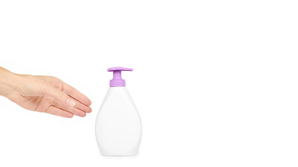 White hand sanitizer soap dispenser in hand isolated on white background. Housework and sanitary concept. copy space, template