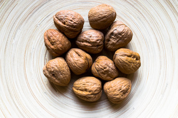 Whole Walnuts on Bamboo Plate